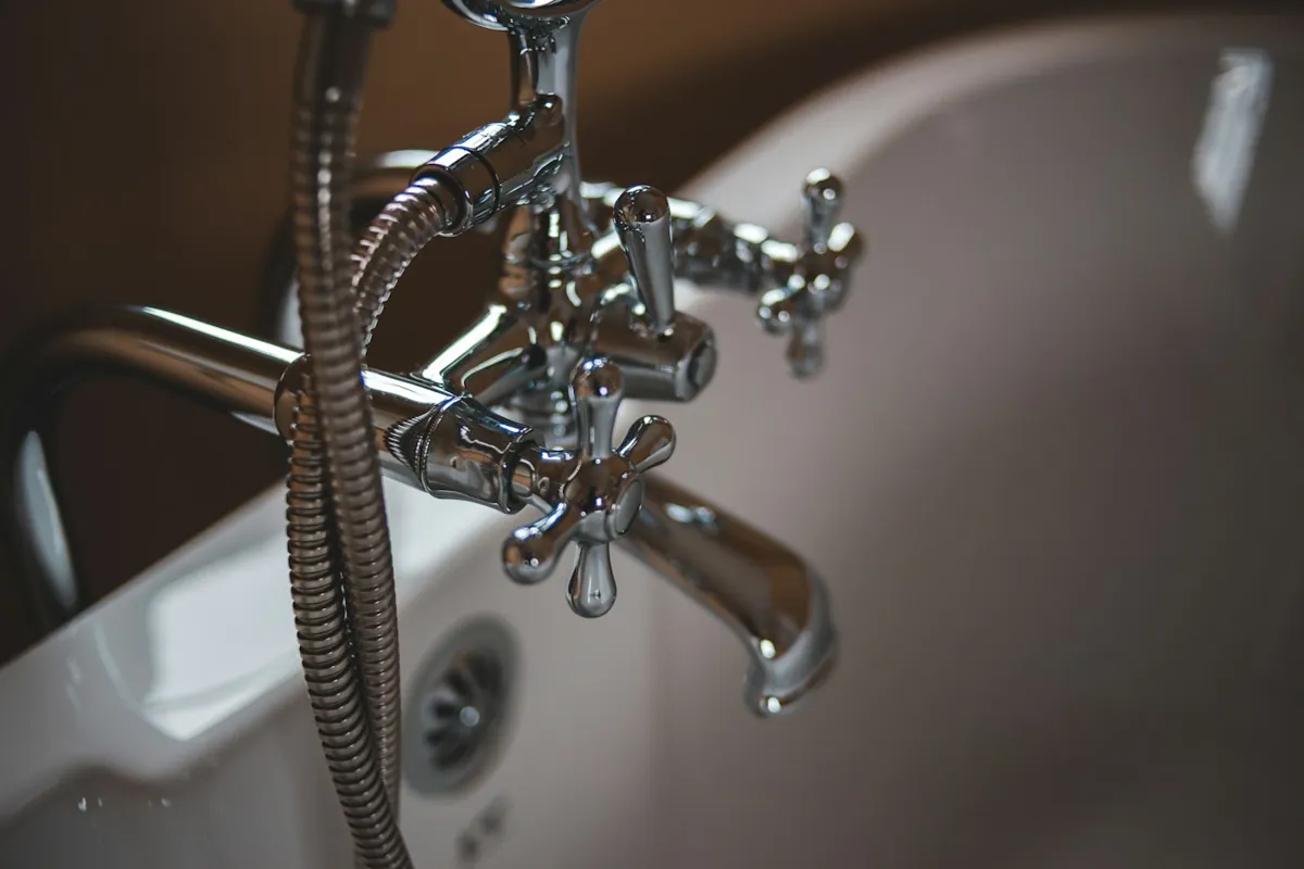 Chrome faucet and valve fittings in close up